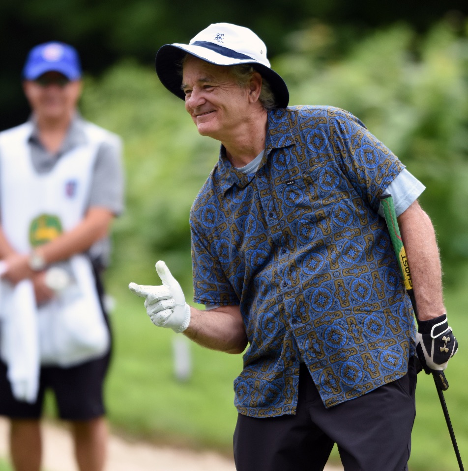 Actor Bill Murray jokes around with the gallery after making his putt on the 5th green during the John Deere Classic Pro Am, Wednesday July 8, 2015. (Photo by Todd Mizener - Dispatch/Argus)
