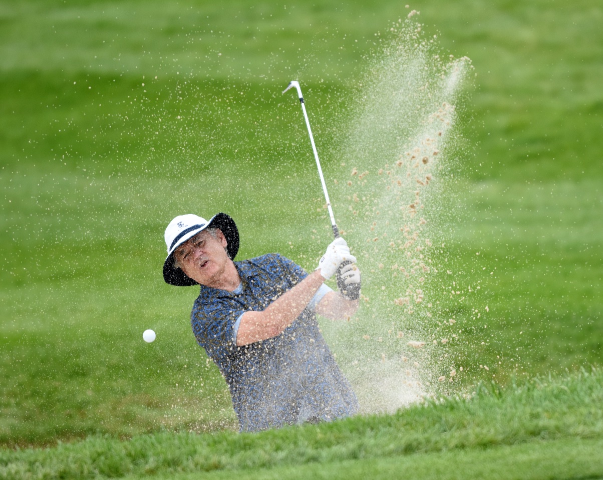 Actor Bill Murray hits out of the bunker at the 6th green during the John Deere Classic Pro-Am, Wednesday July 8, 2015, in Silvis. (Photo by Todd Mizener - Dispatch/Argus)