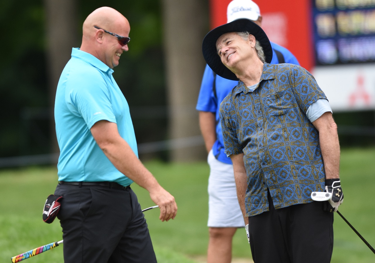 Actor Bill Murray jokes around with playing partner Jason Luebbe while they putt on the 9th green during the John Deere Classic Pro-Am, Wednesday July 8, 2015. (Photo by Todd Mizener - Dispatch/Argus)