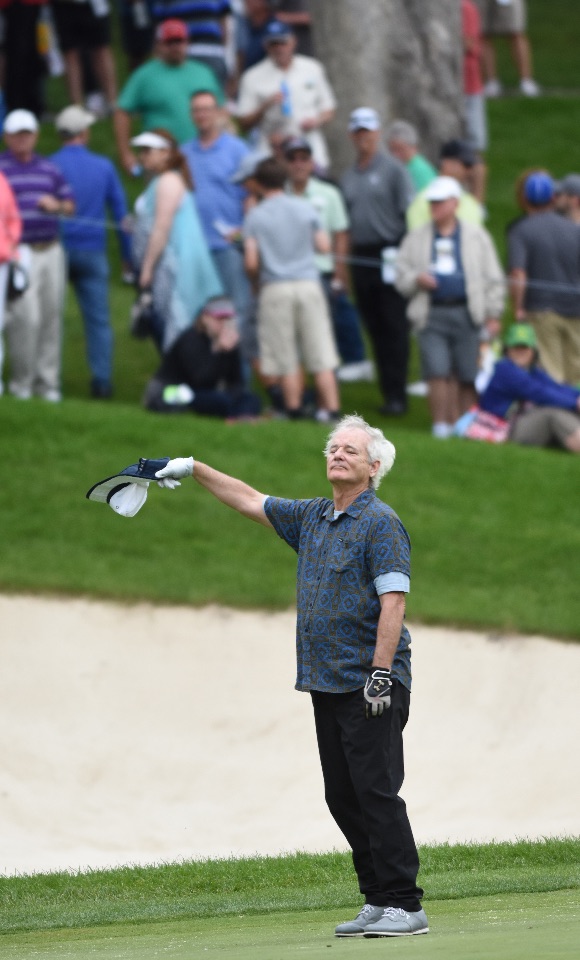 Actor Bill Murray acknowledges the applause from the large gallery at the 18th green before finishing the John Deere Classic Pro-Am Wednesday July 8, 2015, in Silvis. (Photo by Todd Mizener - Dispatch/Argus)