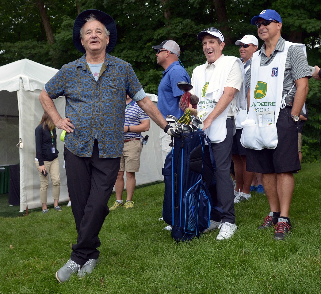 Cubs fan Bill Murray jokes with some Cardinals fans before teeing off on the 1st hole of the John Deere Classic Pro-Am Wednesday July 8, 2015. At right are Mr. Murray's two local caddies Chris Ontiveros and Dr. Scott Robertson. (Photo by Todd Mizener - Dispatch/Argus)