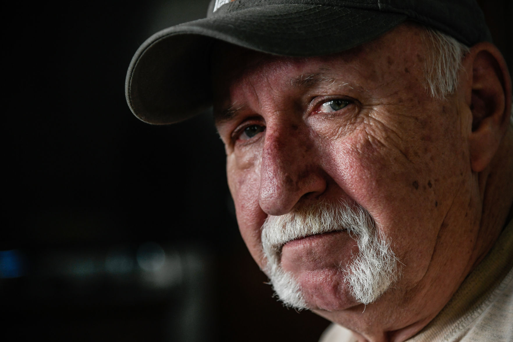 Vietnam veteran John Schmidt, of Davenport, poses for a portrait in his living room Wednesday. Schmidt, who was born in Detroit but raised in and around Reynolds, Illinois served as combat engineer from 1967 to 1971.