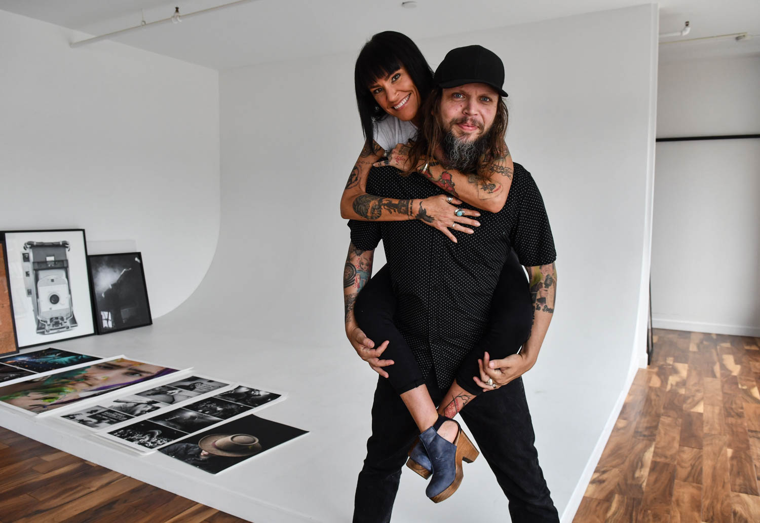 Artists Josh and Aimee Ford pose for a portrait in Josh's photo studio Wednesday, June 27, 2018. The husband and wife each have studios on the first floor of the former LeClaire Hotel on 5th Avenue in Moline. Josh is a multimedia photographer who also runs the runs the "Cinema at the Figge" program. Aimee is multi-talented visual artist. 